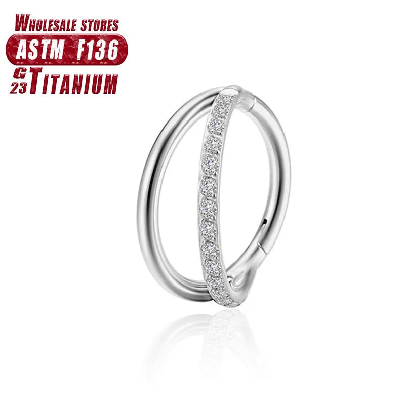 Titanium alloy fork-style nose ring on a plain background, showing the corkscrew shape and post.