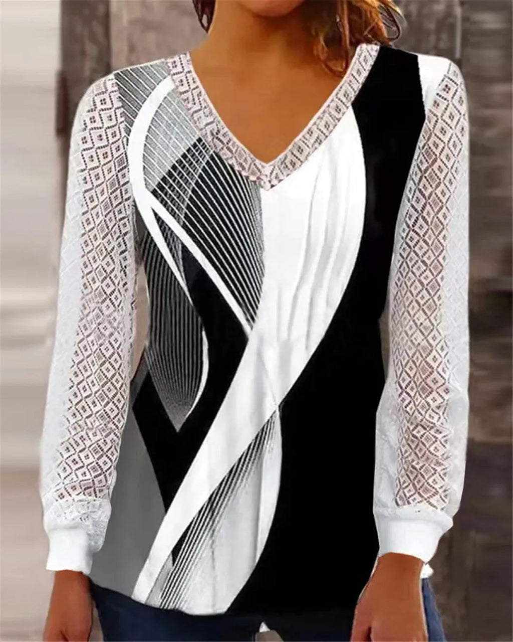 Purple loose V-neck women's top with long sleeves and a hollow-out lace print pattern.