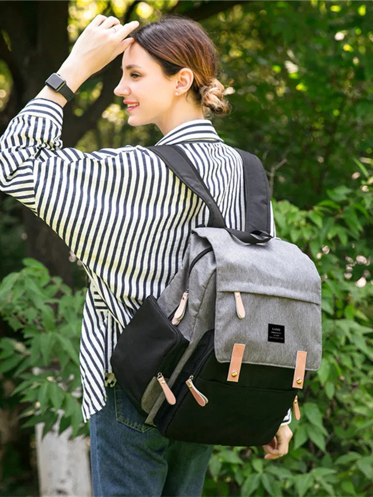 Land Mommy MPB86 grey diaper backpack with changing mat, showing main compartment and straps.