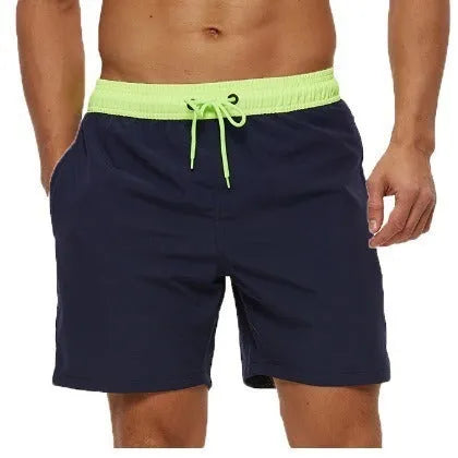 Men's blue training shorts with stitching waist detail and headband pocket