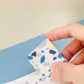 White brick-shaped rubber eraser for traceless pencil mark removal on paper