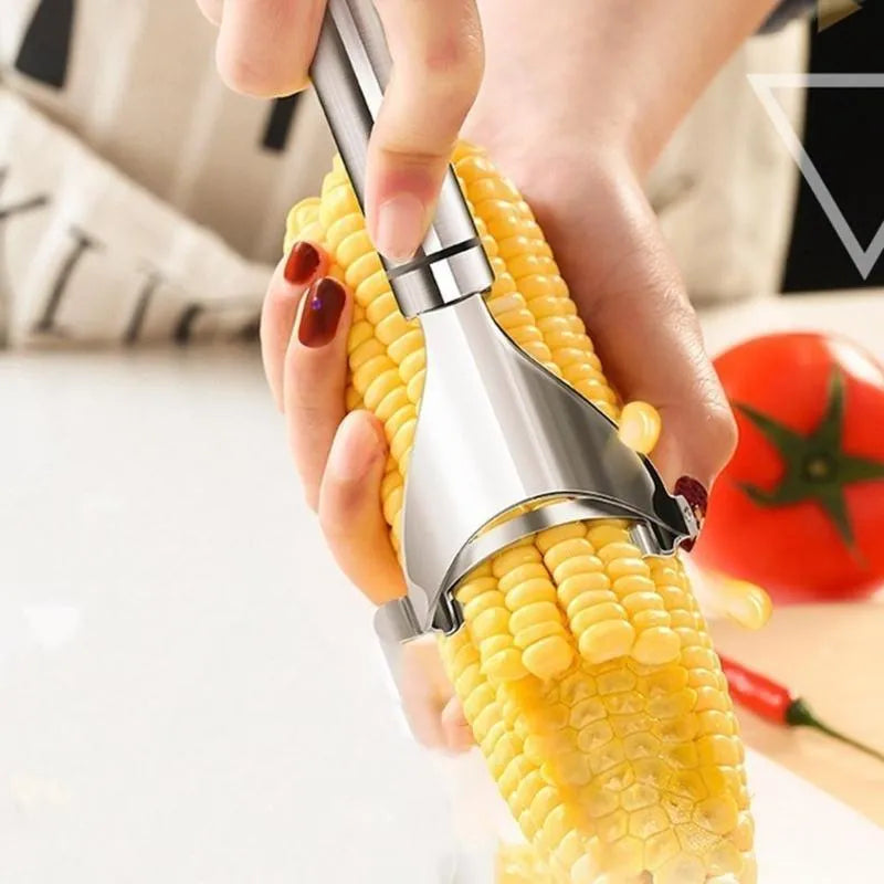 Stainless steel corn planer with silver finish on a kitchen surface measuring 18cm long