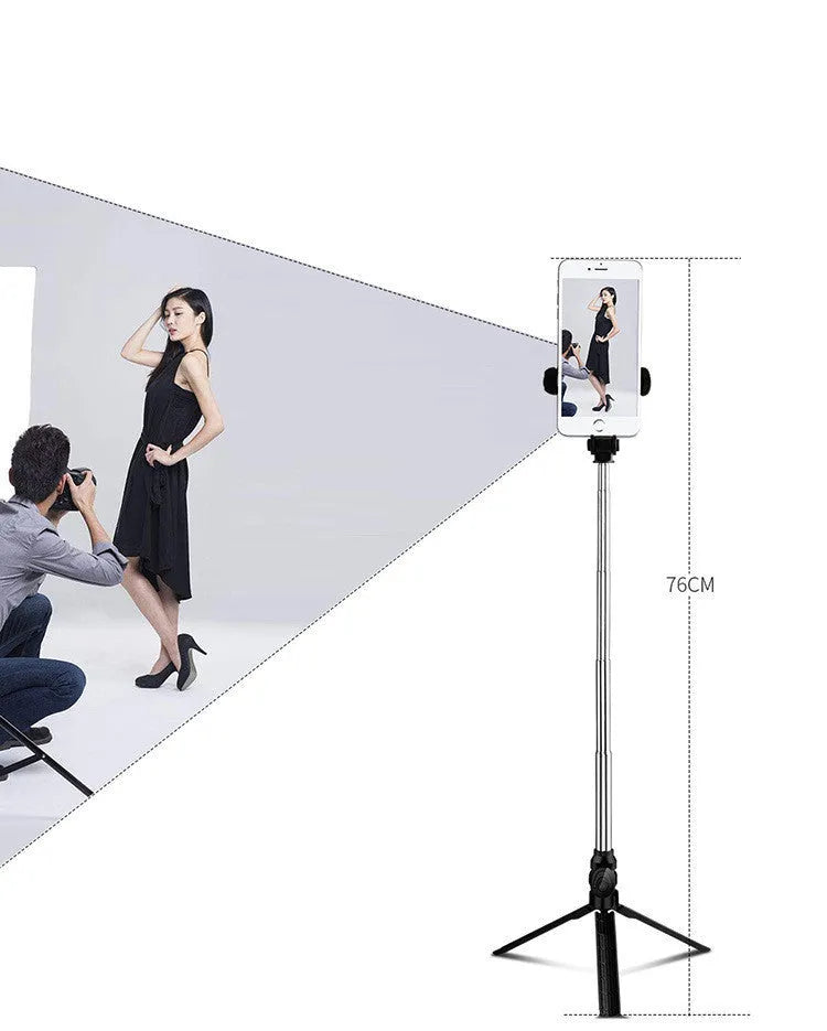 Bluetooth selfie stick tripod with remote control extended, showing adjustable phone clip in black colour.