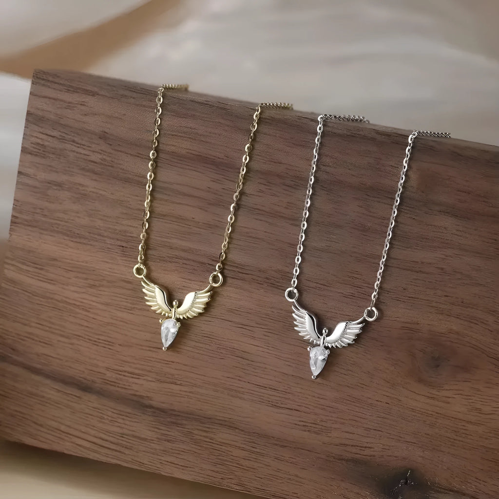 Women's 925 silver eagle pendant necklace on an adjustable O-ring chain in a white gold or yellow gold electroplated finish.