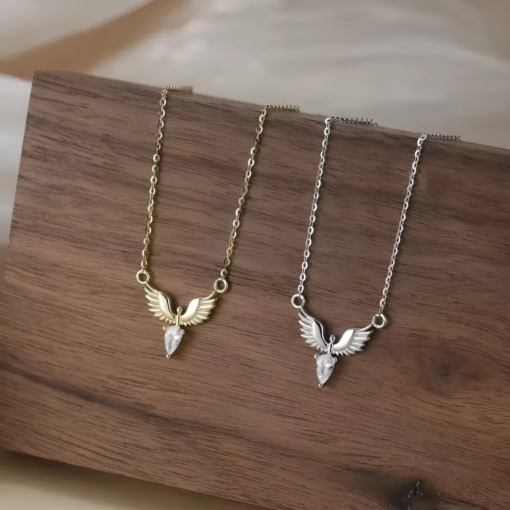 Women's 925 silver eagle pendant necklace on an adjustable O-ring chain in a white gold or yellow gold electroplated finish.