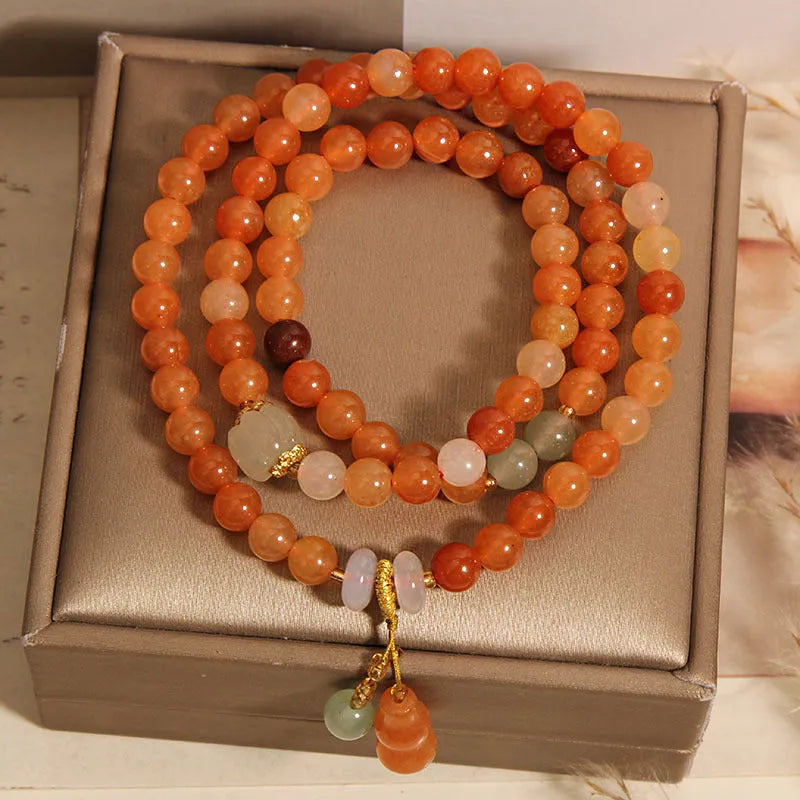 Artistic antique natural Jinsi Jade multi-layer bracelet with pumpkin beads and calabash pendant on white background