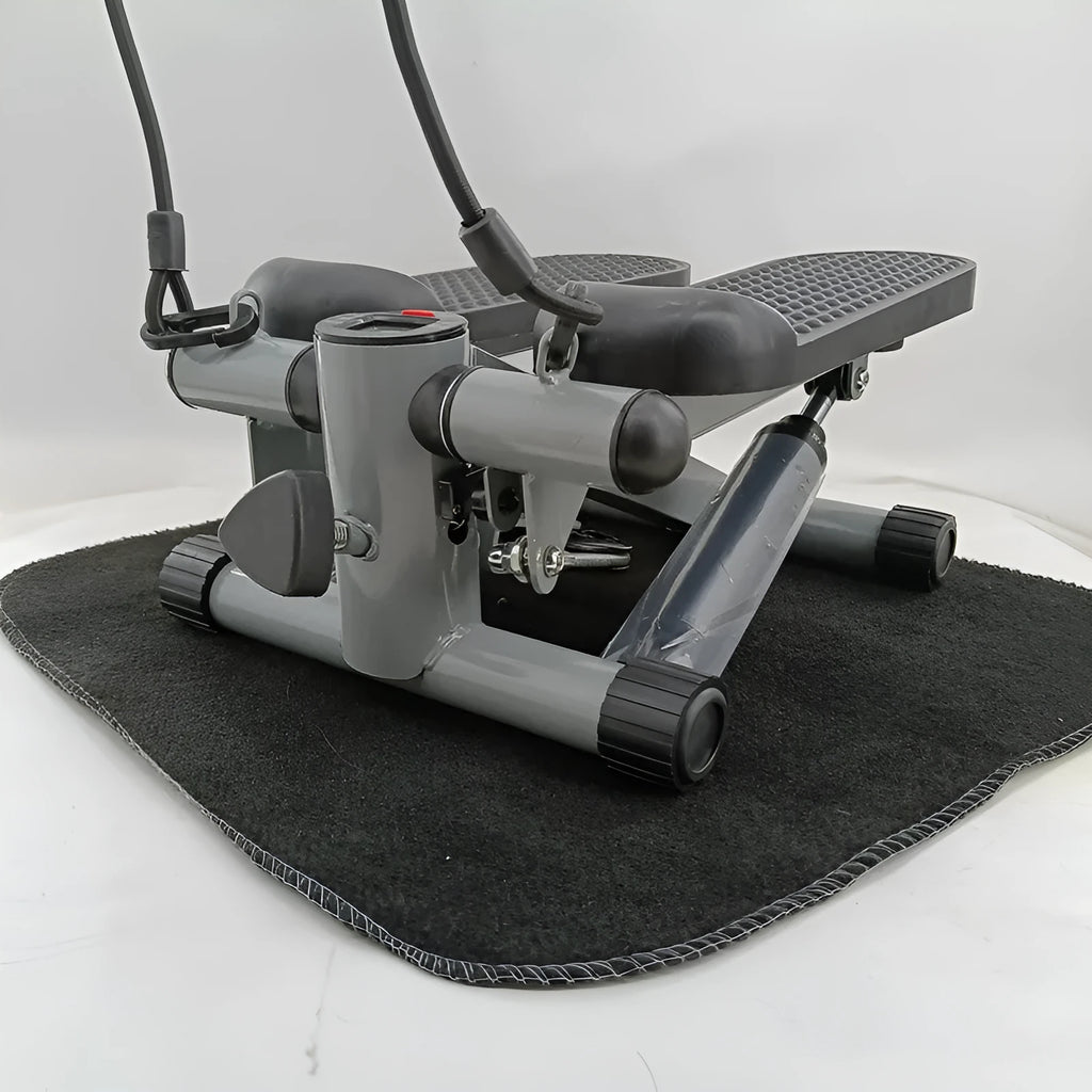 Silver grey mini treadmill waist slimming machine with hydraulic resistance and pedals.