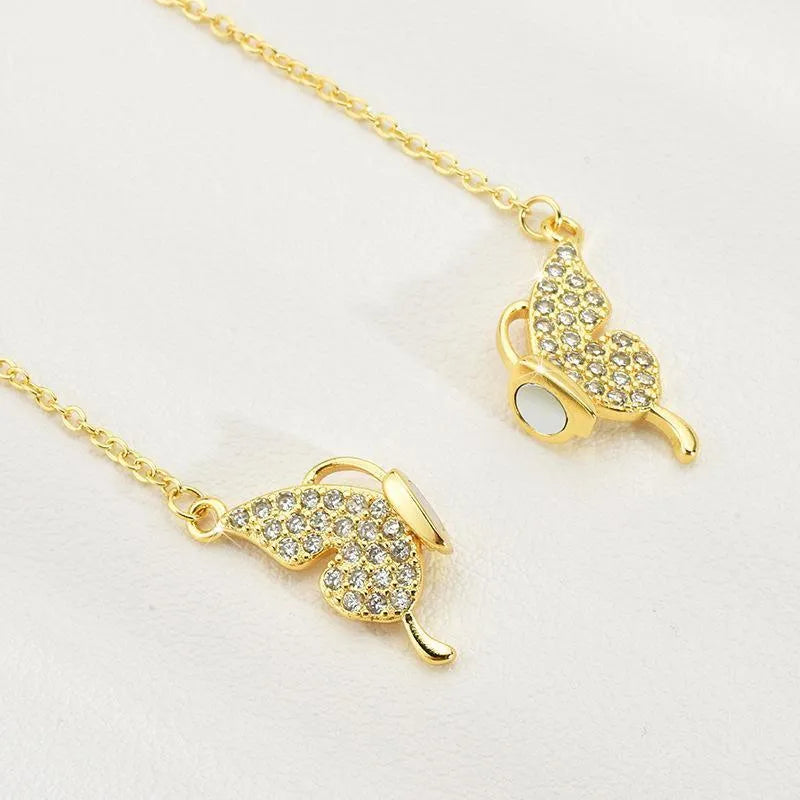 Women's gold tone butterfly necklace with twisted chain and magnetic clasp