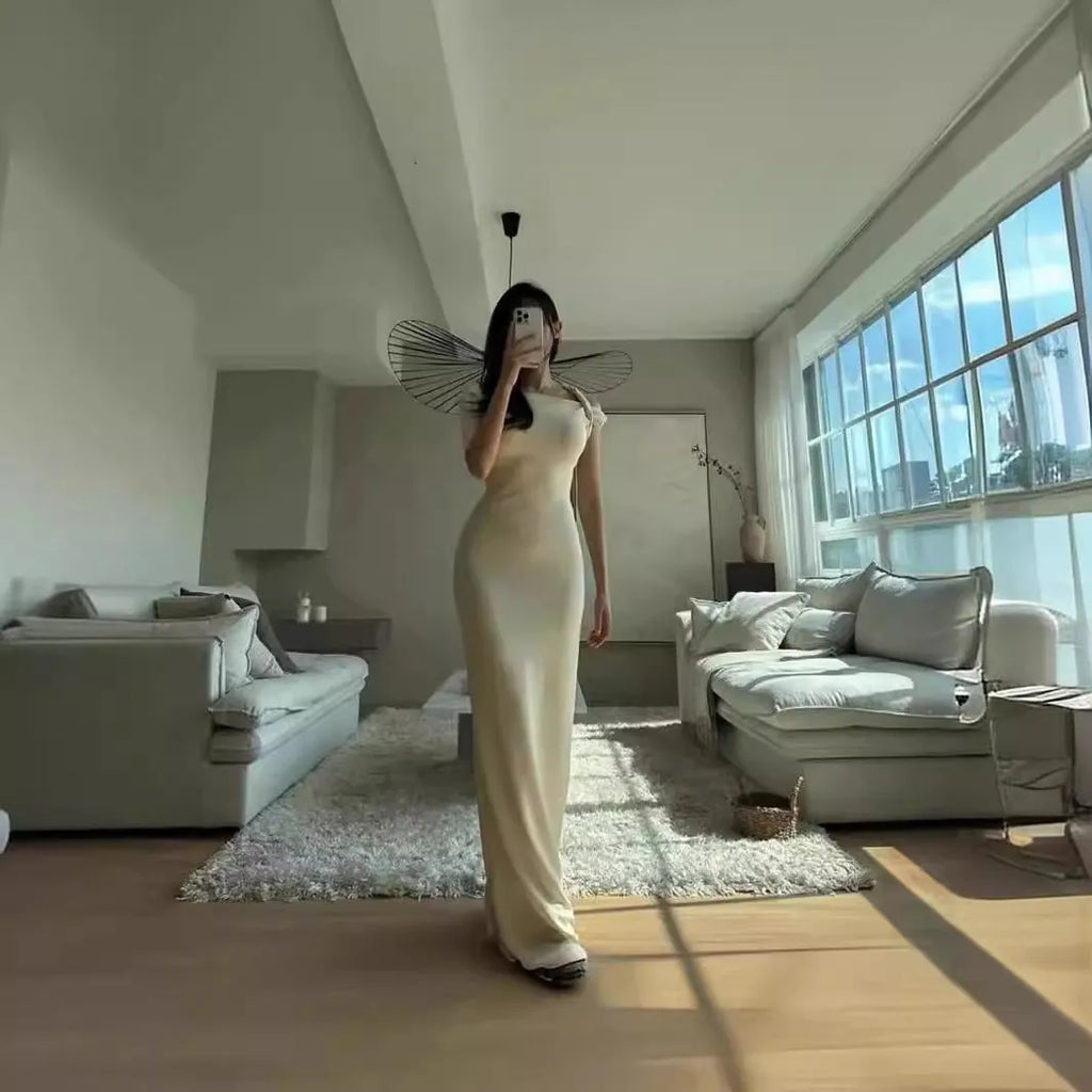 White sloping shoulder high-waist long dress with fold detail from front view