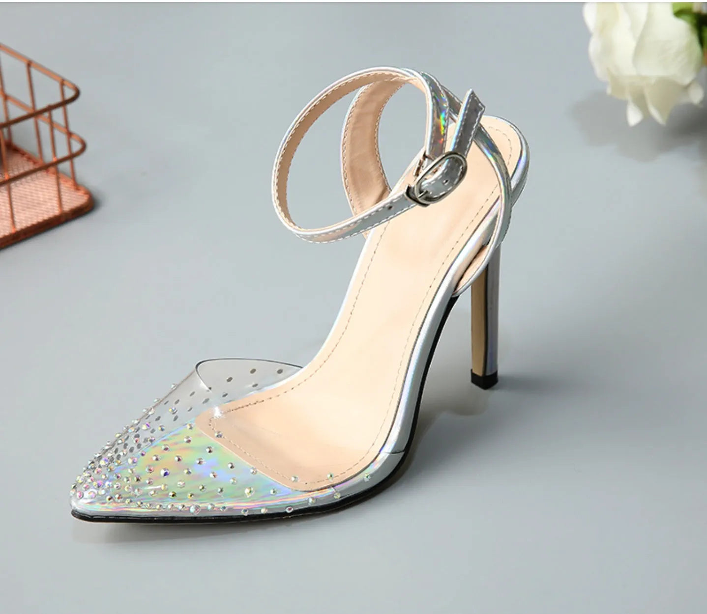 Women's pointed toe stiletto sandals with crystal diamond embellishment on the PVC upper.
