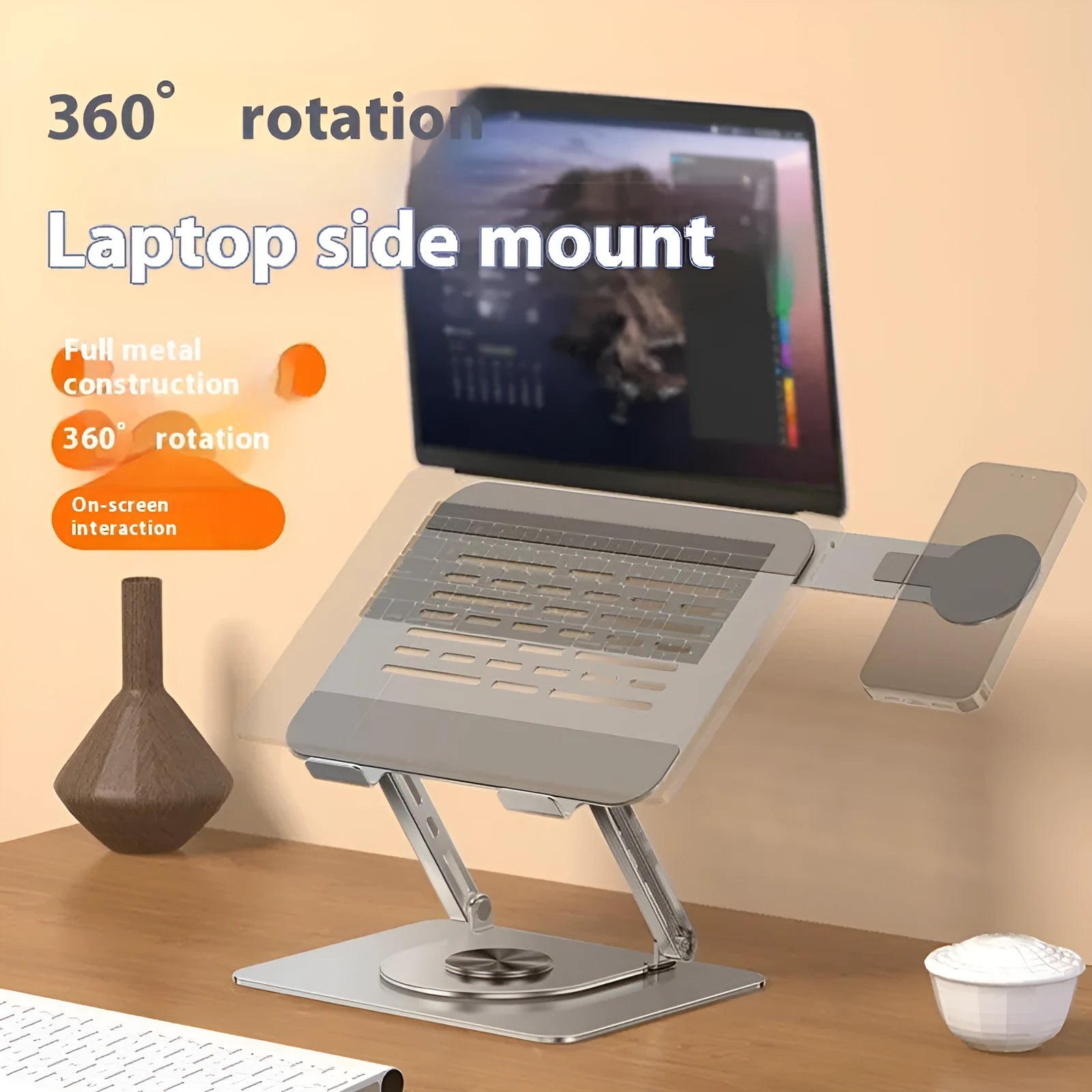 Silver carbon steel laptop stand with side-mounted magnetic phone holder rotated to show 360-degree movement