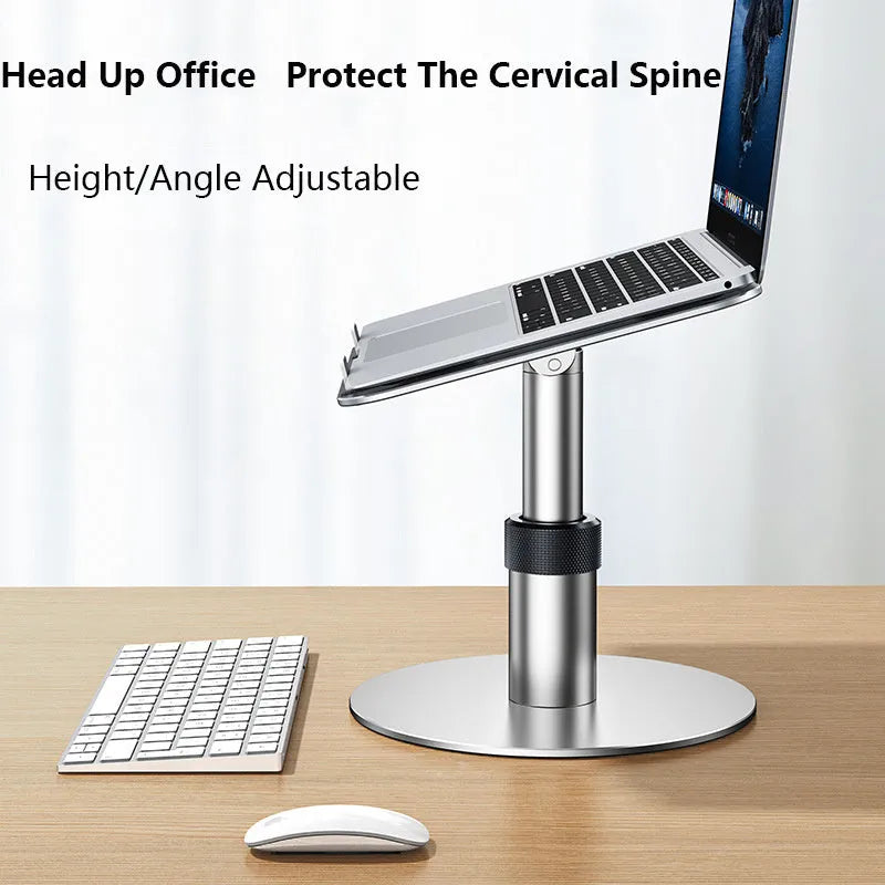Silver adjustable laptop stand with 360-degree rotating base on a wooden desk.