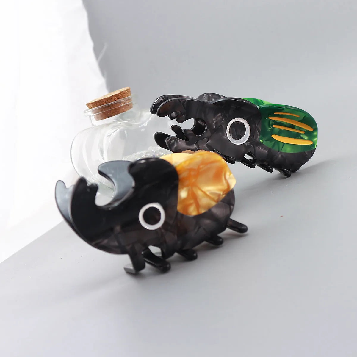 Cellulose acetate beetle grip with insect biology design in green, orange, or white colour options