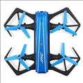 White JJRC H43WH folding drone with four arms deployed and propellers attached outdoors