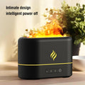 Black USB humidifier with seven-colour flame light effect on a desk.