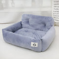 Grey and blue plaid stain-resistant cloth pet nest for car travel, shown in small and large sizes.