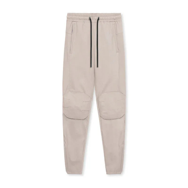 Men's loose-fit ankle-tied trousers in olive green, suitable for fitness and casual wear.