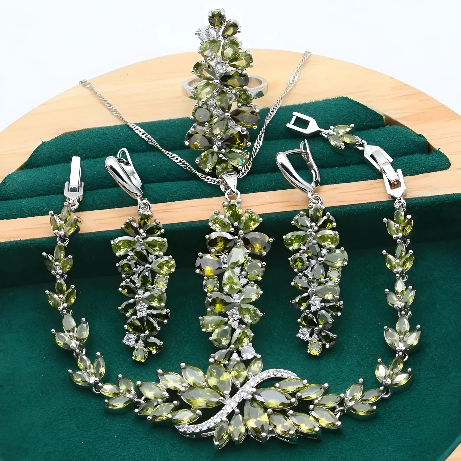 Retro-style jewellery set with necklace, bracelet, earrings, and ring featuring floral patterns in olive and purple colours.