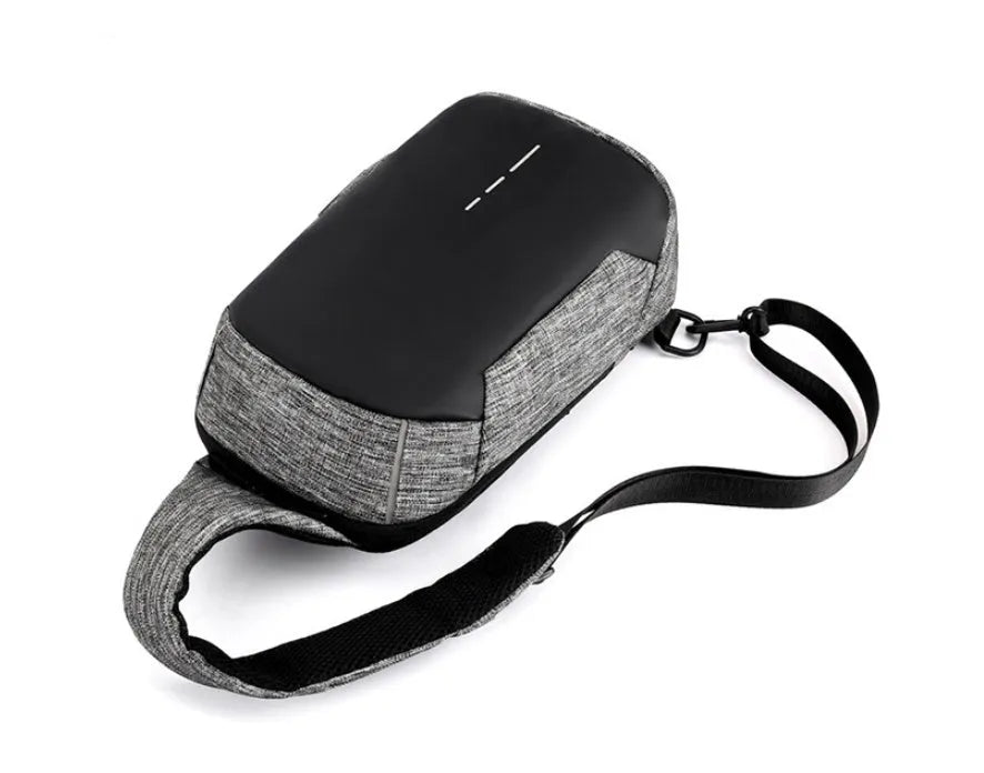 Small dark blue Oxford cloth waterproof chest bag with a zipper and adjustable strap, shown with a phone in the dedicated compartment.