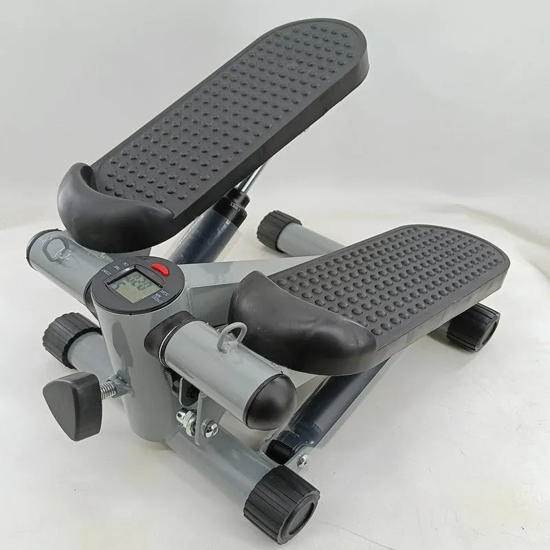 Silver grey mini treadmill waist slimming machine with hydraulic resistance and pedals.