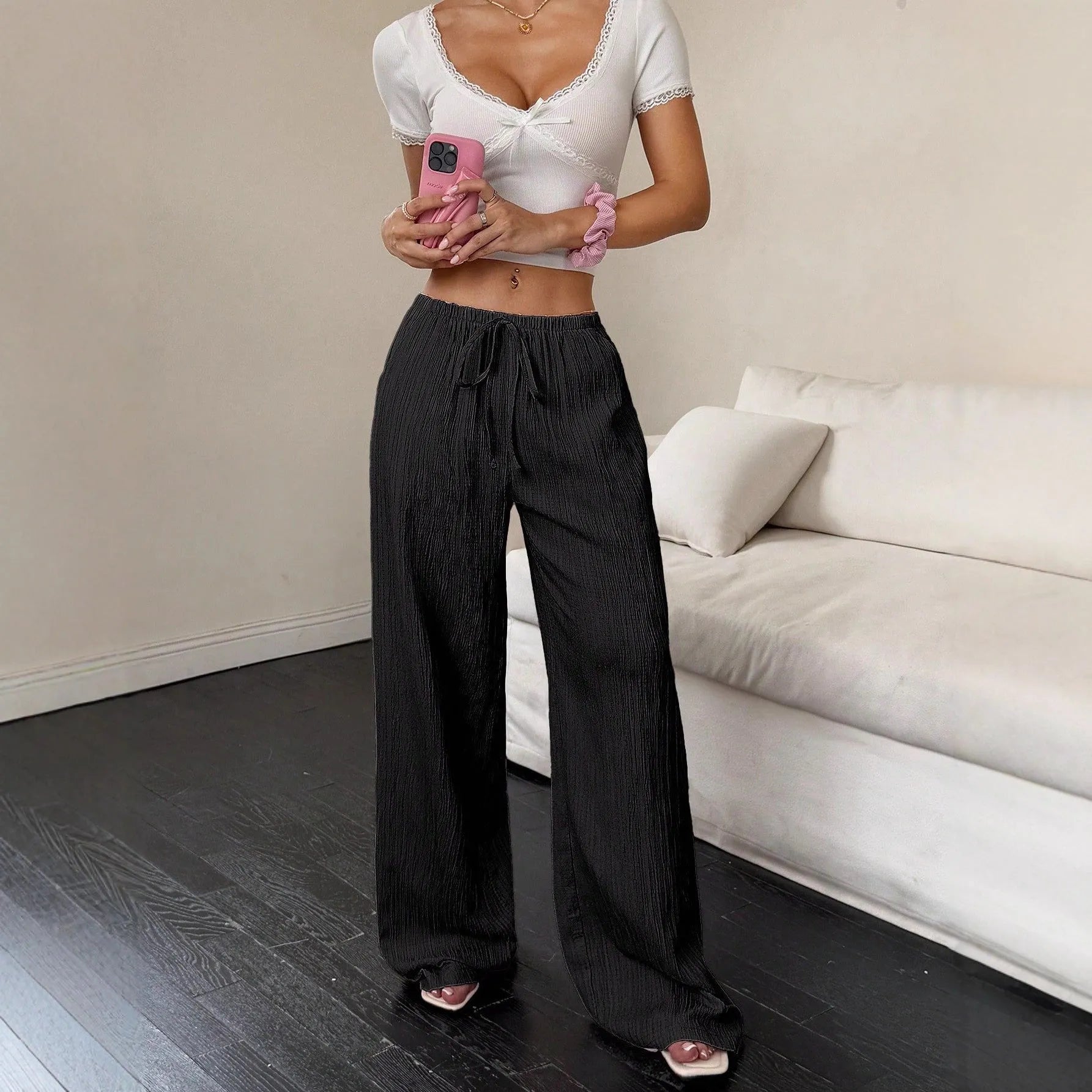Women's black wide leg trousers with lace-up waist trimming on mid waist