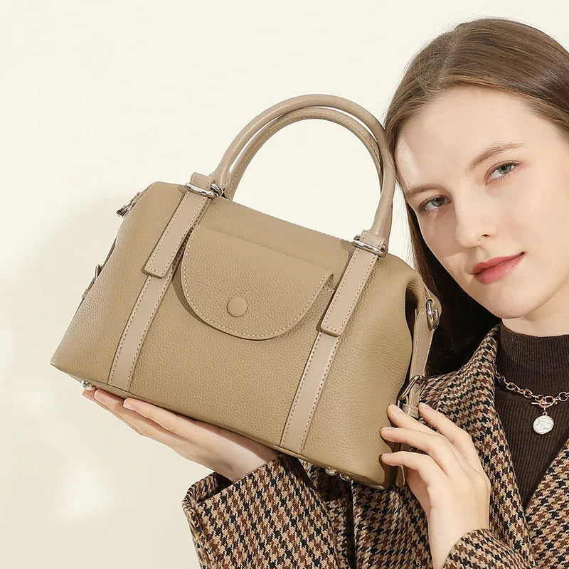 Genuine leather ladies handbag in black, brown, or elephant grey with lock detail and shoulder strap