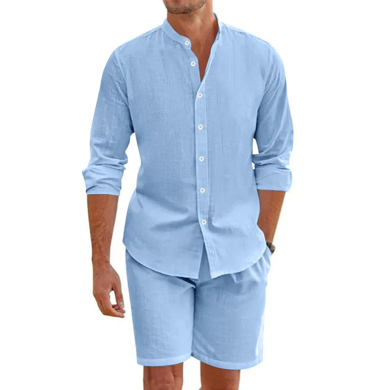 Man wearing a dark grey linen blend short sleeve shirt and matching drawstring shorts summer suit.