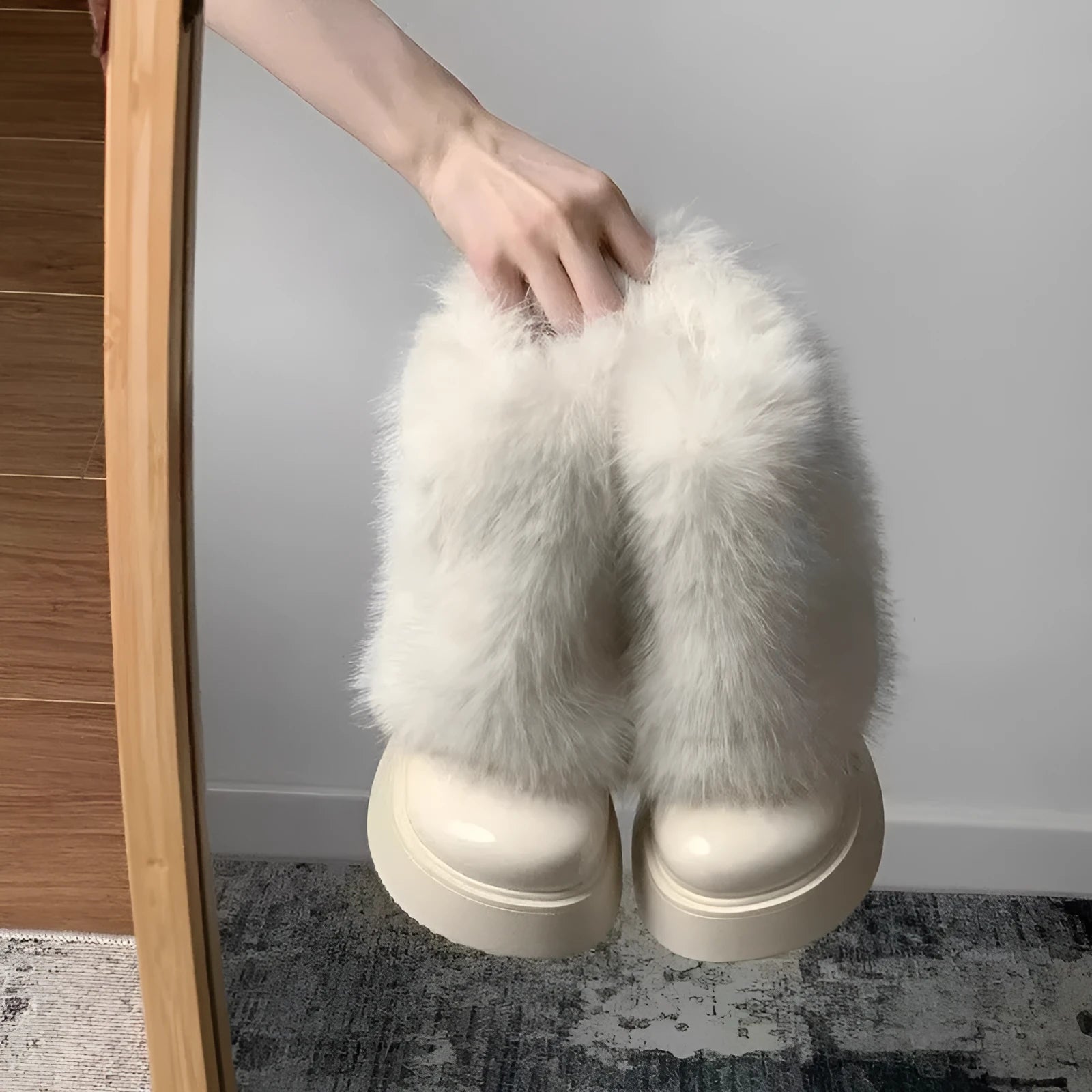 Women's black fleece-lined snow boots with a waterproof rubber platform sole on a white background.
