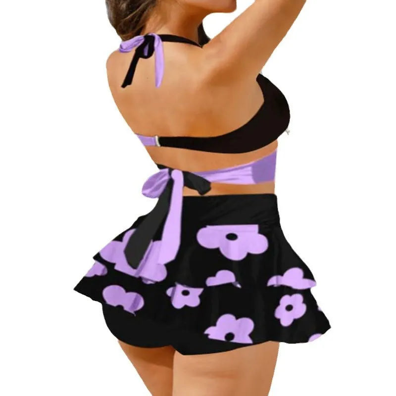 Women's purple bikini set with lace-up detail on split skirt and high-waist briefs.