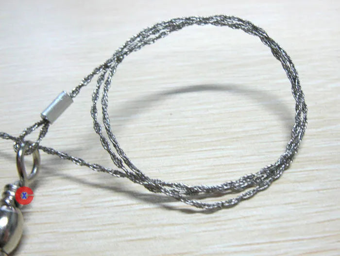 Stainless steel survival wire saw with pull rings, 55cm blade for outdoor wood cutting.