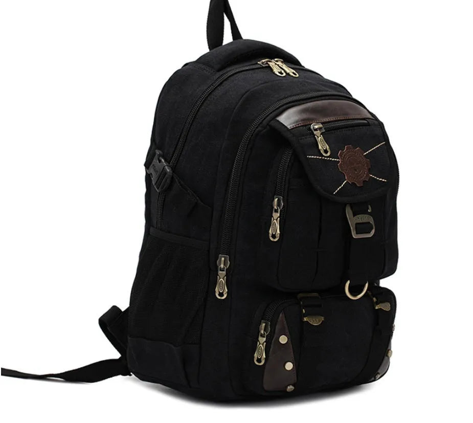 Large canvas computer backpack in military green with car stitching and top handle