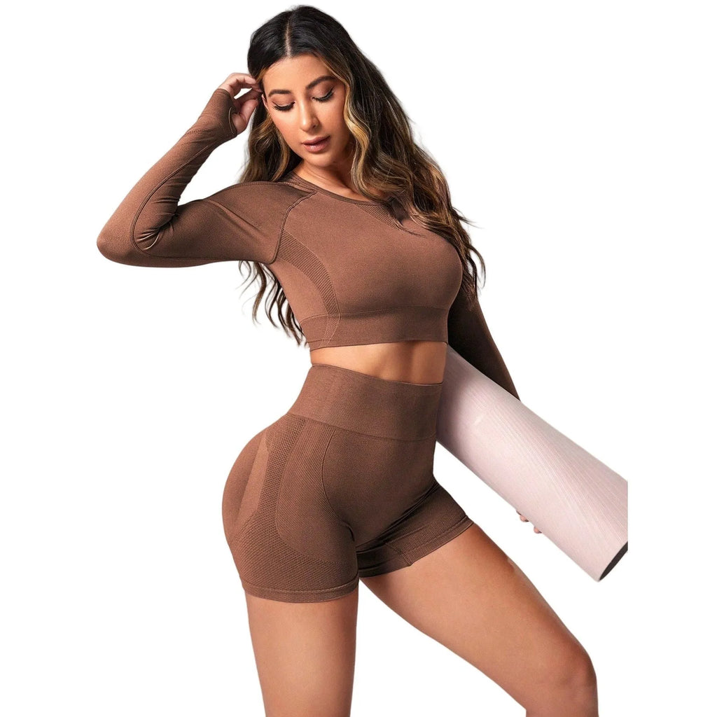 Women's black yoga clothing set with long sleeve top and high-waisted leggings