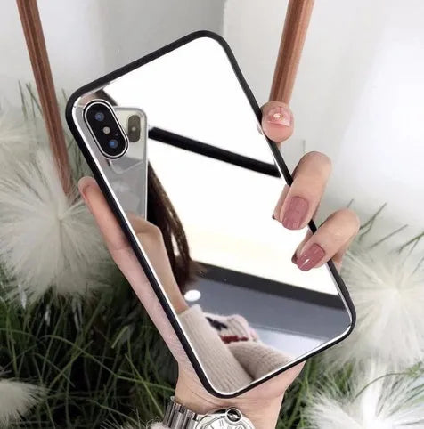 Black iPhone mirror phone case showing reflective surface on back, compatible with iPhone X and other models.