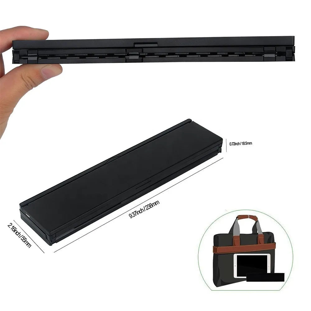 Black foldable ultra-thin wireless Bluetooth keyboard for tablets shown open next to a mobile phone.