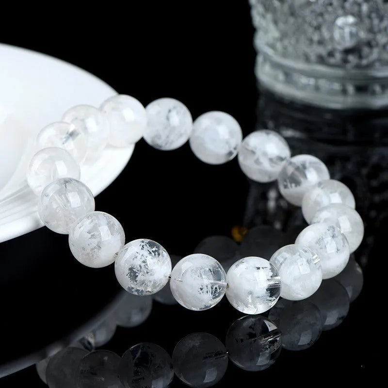 Women's bracelet with round blizzard snowflake crystal beads and traditional Ruyi Xiangyun decorative elements.