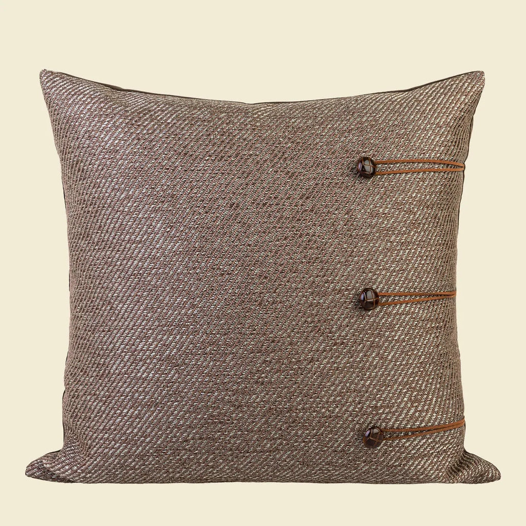 Chinese style square pillow cushion with geometric pattern in Maillard colours on sofa