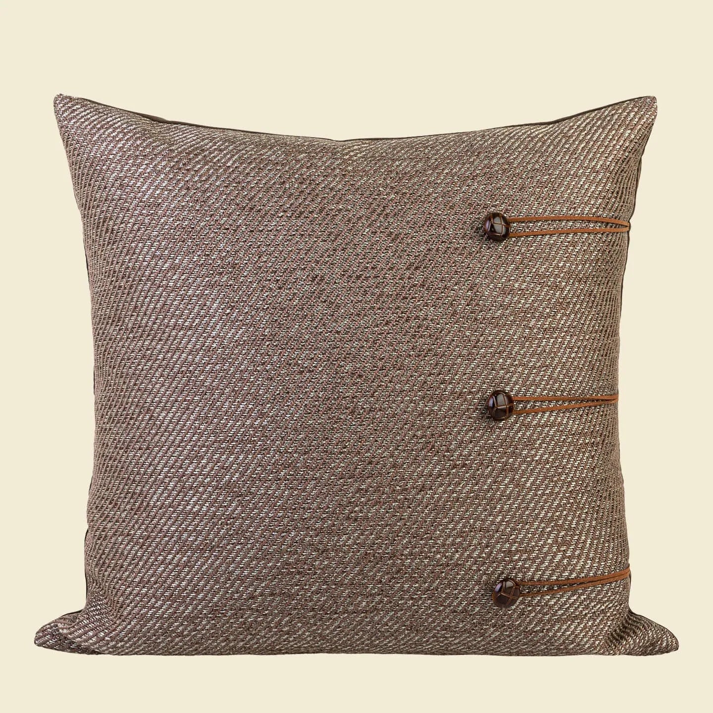 Chinese style square pillow cushion with geometric pattern in Maillard colours on sofa