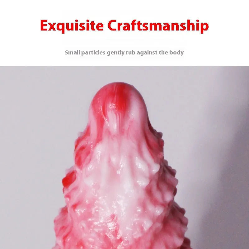 Pink platinum silicone penis-shaped masturbation toy on a neutral background