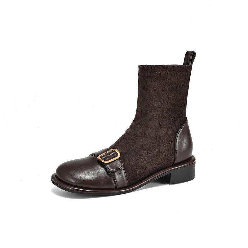 Women's black low-heel Martin boots with lace-up front and decorative belt buckle stitching.