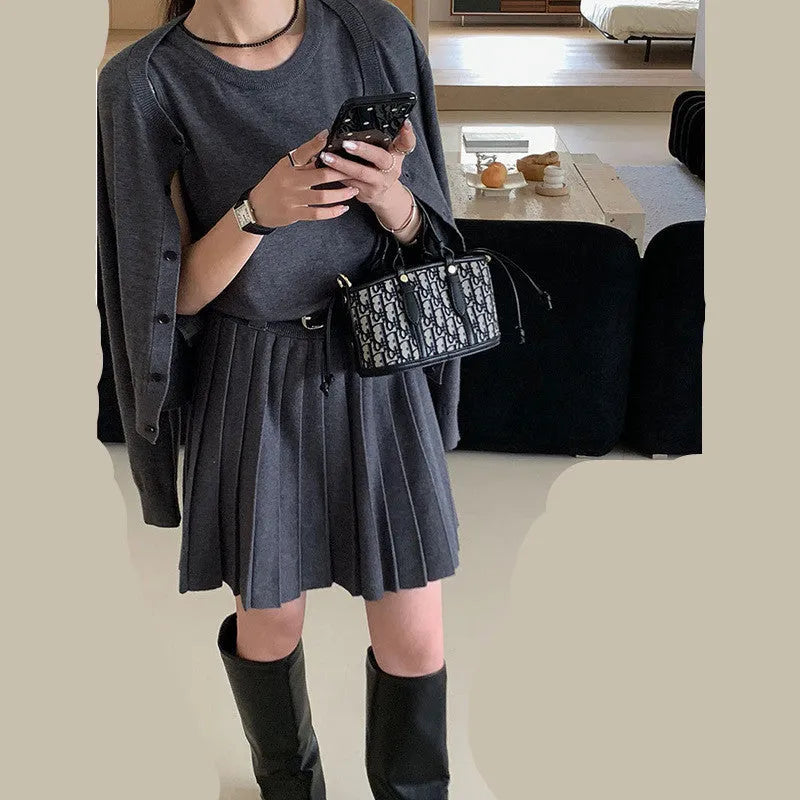 Women's grey Art retro style two-piece set with long-sleeved cardigan and pleated vest skirt featuring a belt