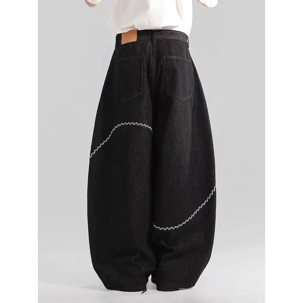 Black straight-leg denim trousers with mid-waist and zip fly for autumn winter wear