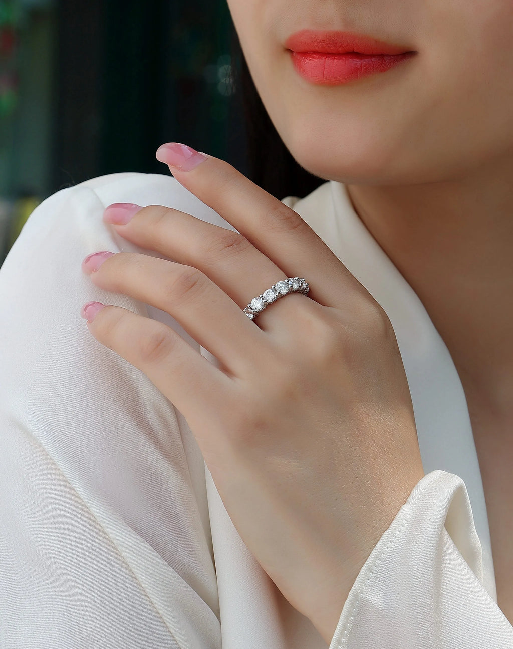 Ferris Wheel moissanite ring set in S925 silver with platinum plating on a white background
