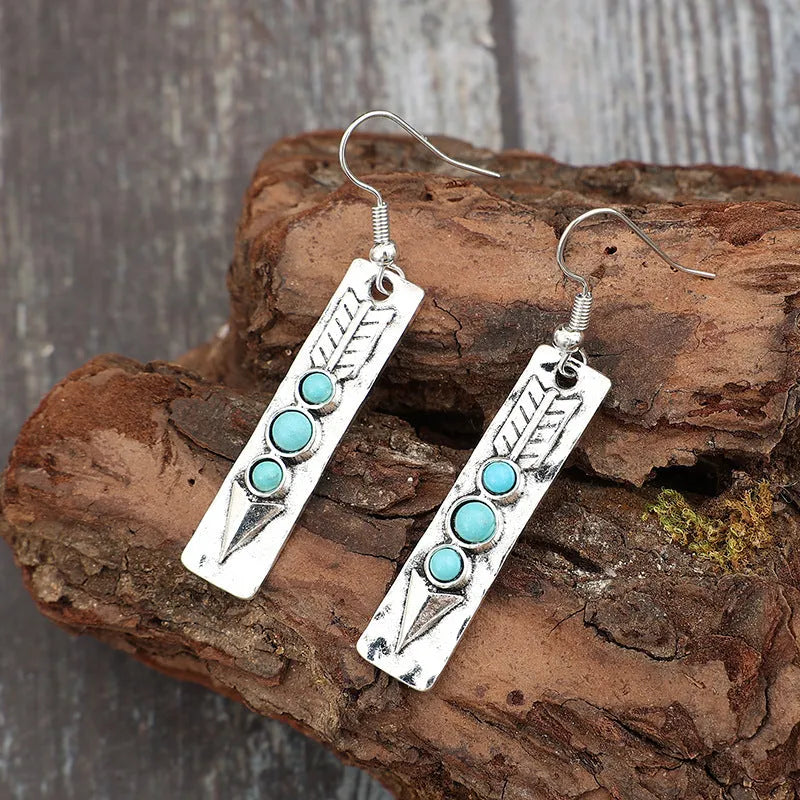Silver geometric long strip earrings with turquoise inlay detailing and retro styling