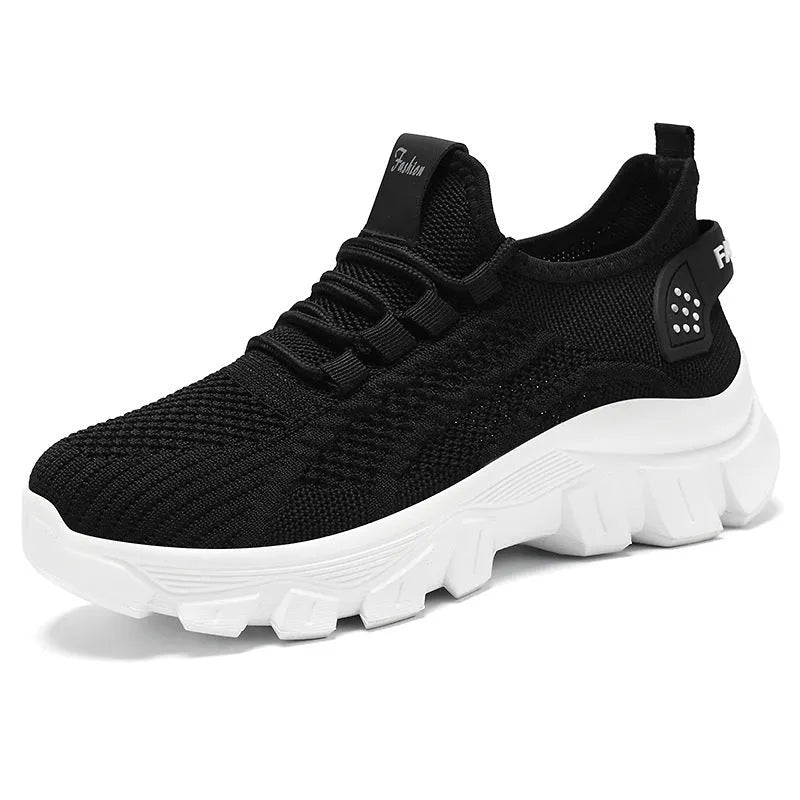 Women's white Flyknit sneaker with thick PVC sole and front lace-up design