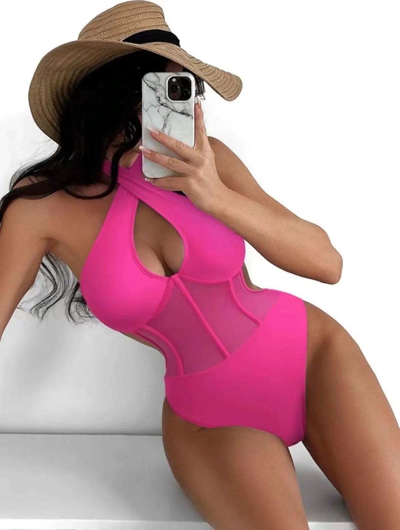 A women's one-piece bikini swimsuit in a nylon-spandex blend, shown in black, rose red, and green colour options.