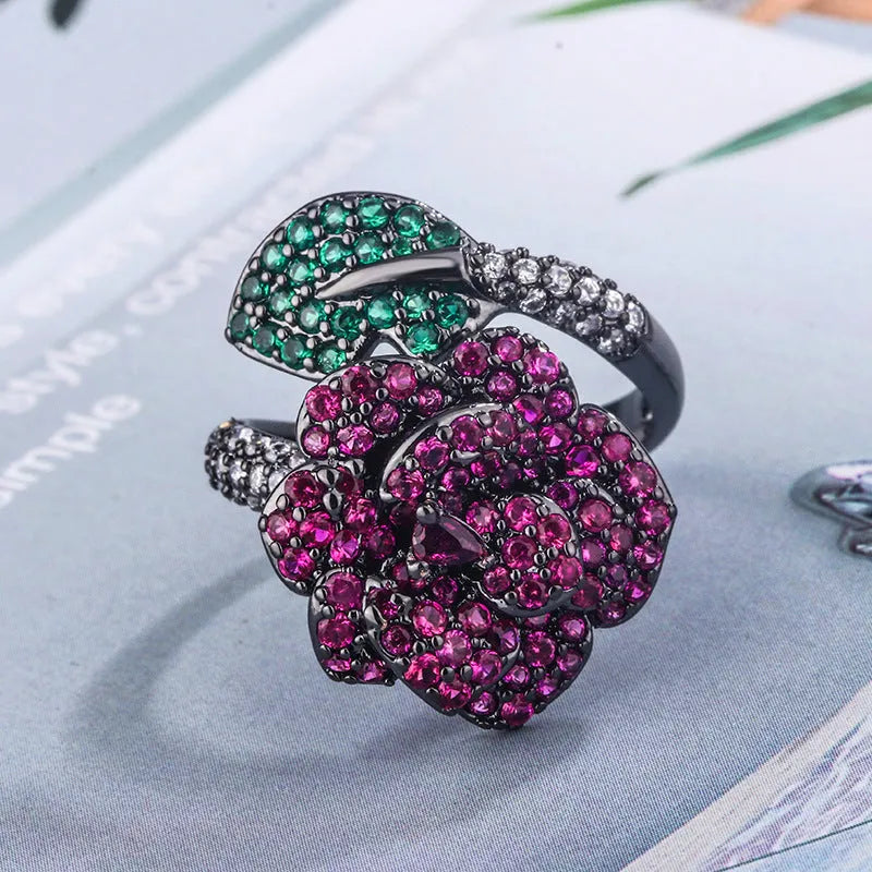 Gold-plated black gold flower personality ring with simulated red corundum stones