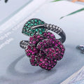 Gold-plated black gold flower personality ring with simulated red corundum stones