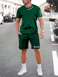 Men's quick-dry polyester sportswear set showing short-sleeved top and matching shorts in a solid colour.
