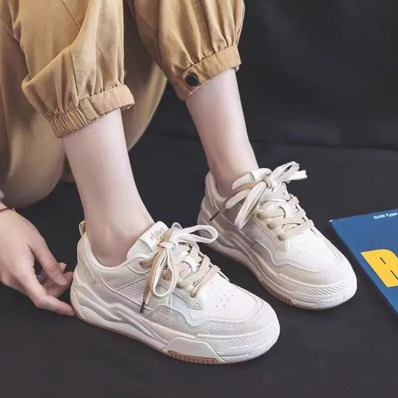 Women's pink and white low-top sneakers with a rubber sole, shown in sizes 35 to 40.
