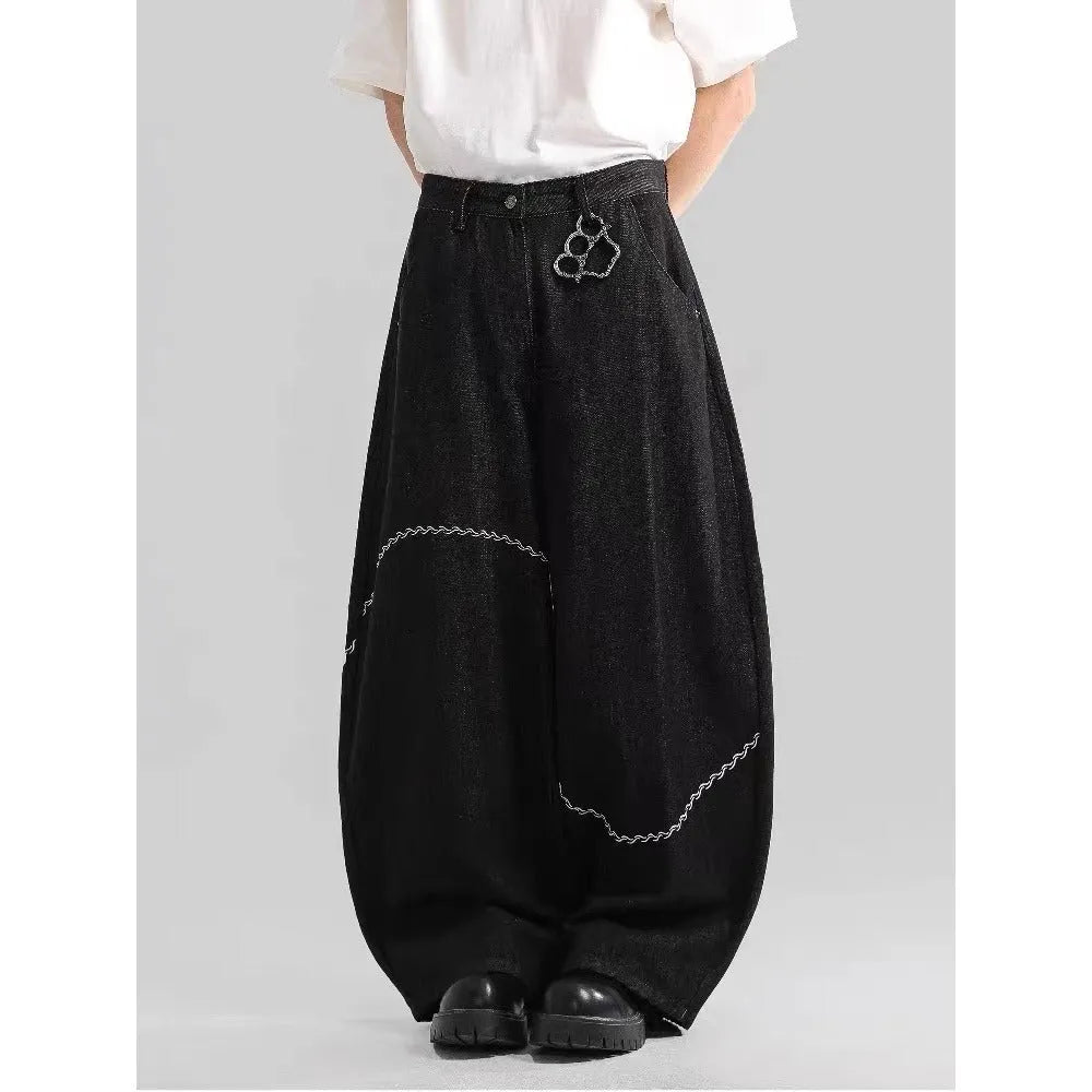 Black straight-leg denim trousers with mid-waist and zip fly for autumn winter wear